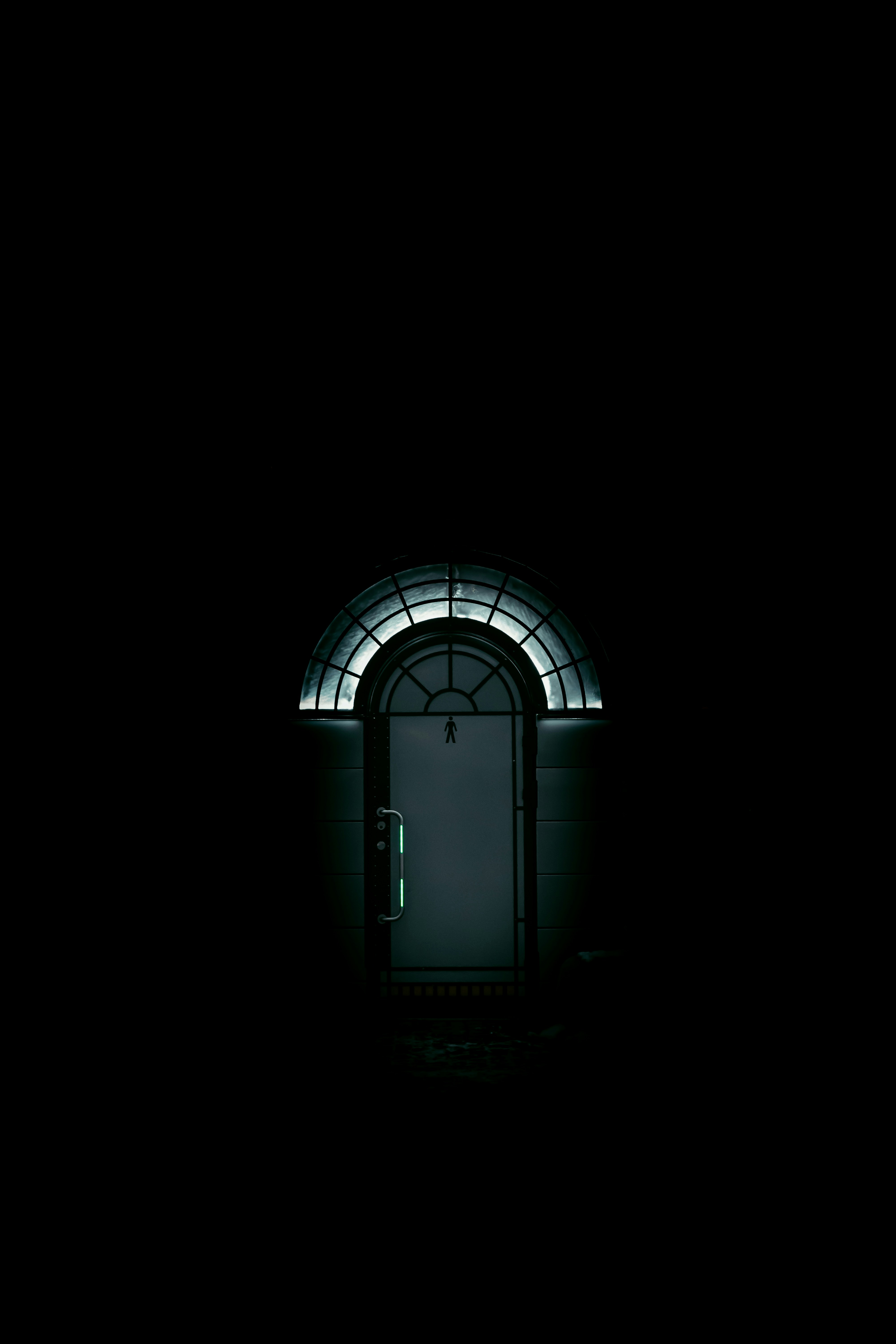 Spooky dark doorway with green fog and mysterious shadows inside