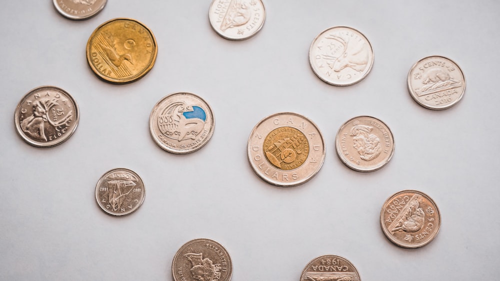 a bunch of different types of coins on a table