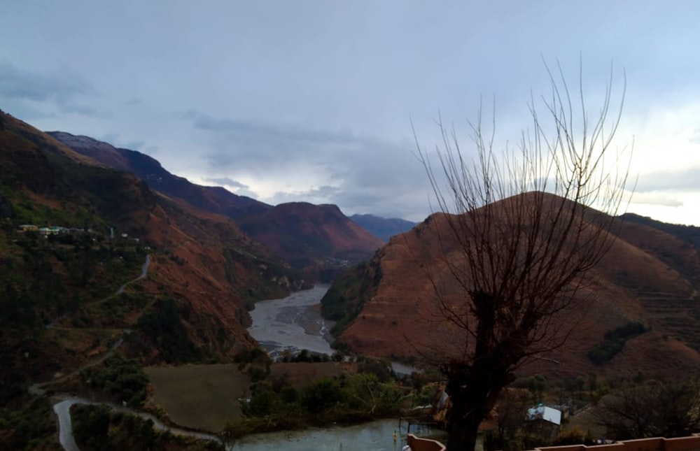 a scenic view of a river and mountains