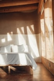 Minimalist bedroom featuring natural light and simple decor.