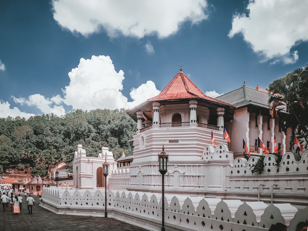 a large white building with a red roof