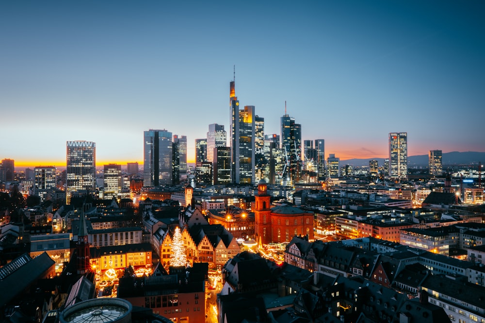 a view of a city at night from the top of a building