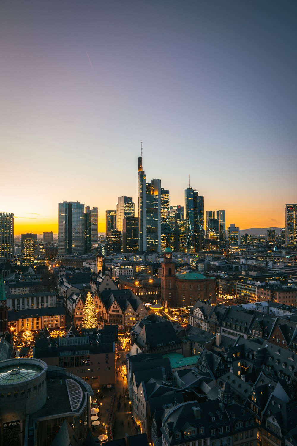 a view of a city at night from the top of a building