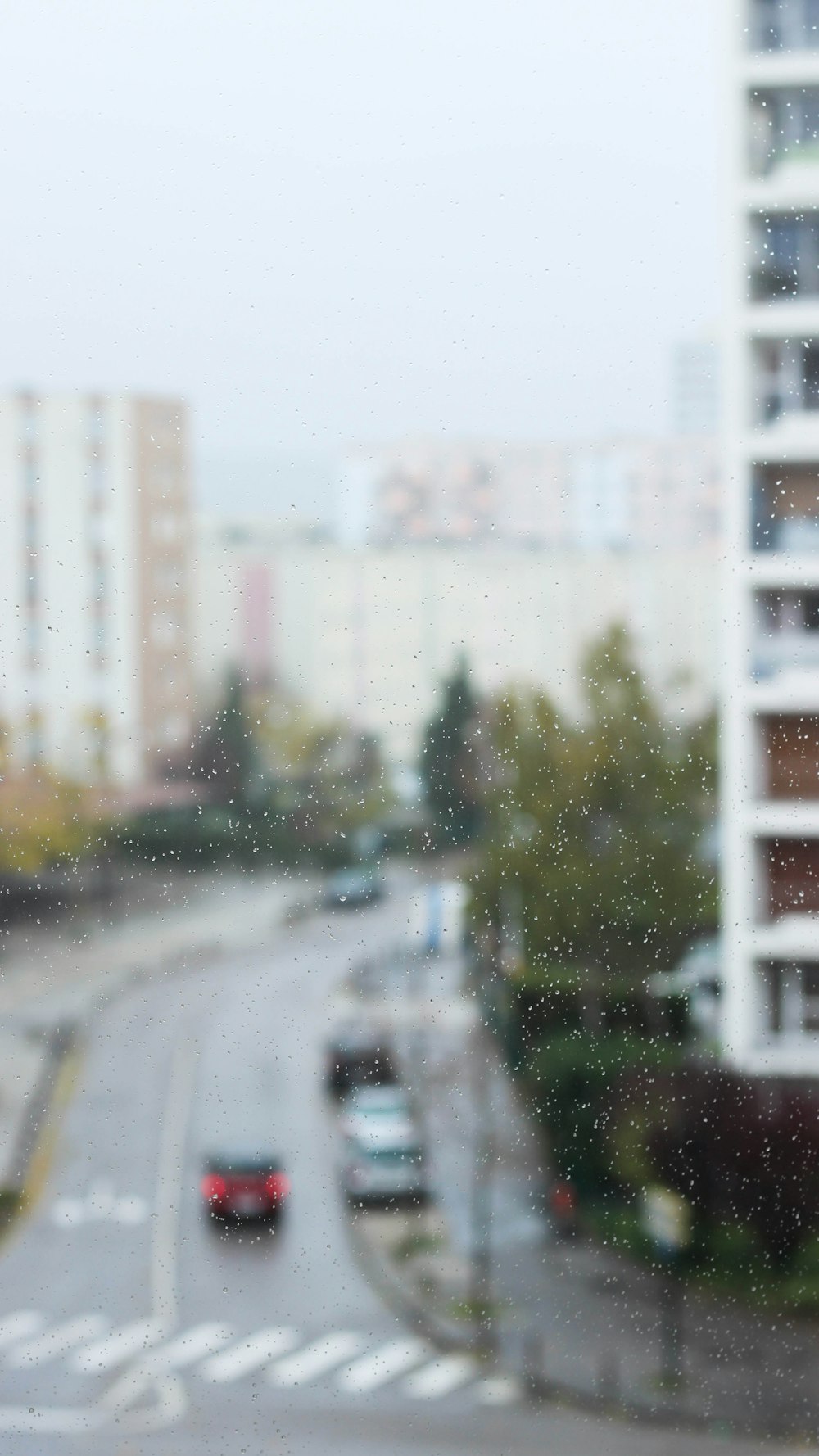 a blurry view of a city street from a window