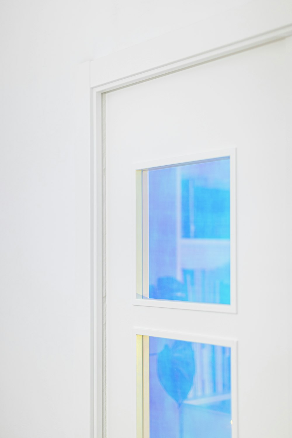 a cat sitting on a window sill in a room