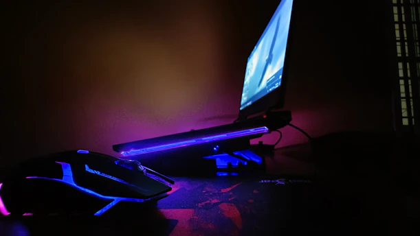 a computer desk with a mouse and a monitor