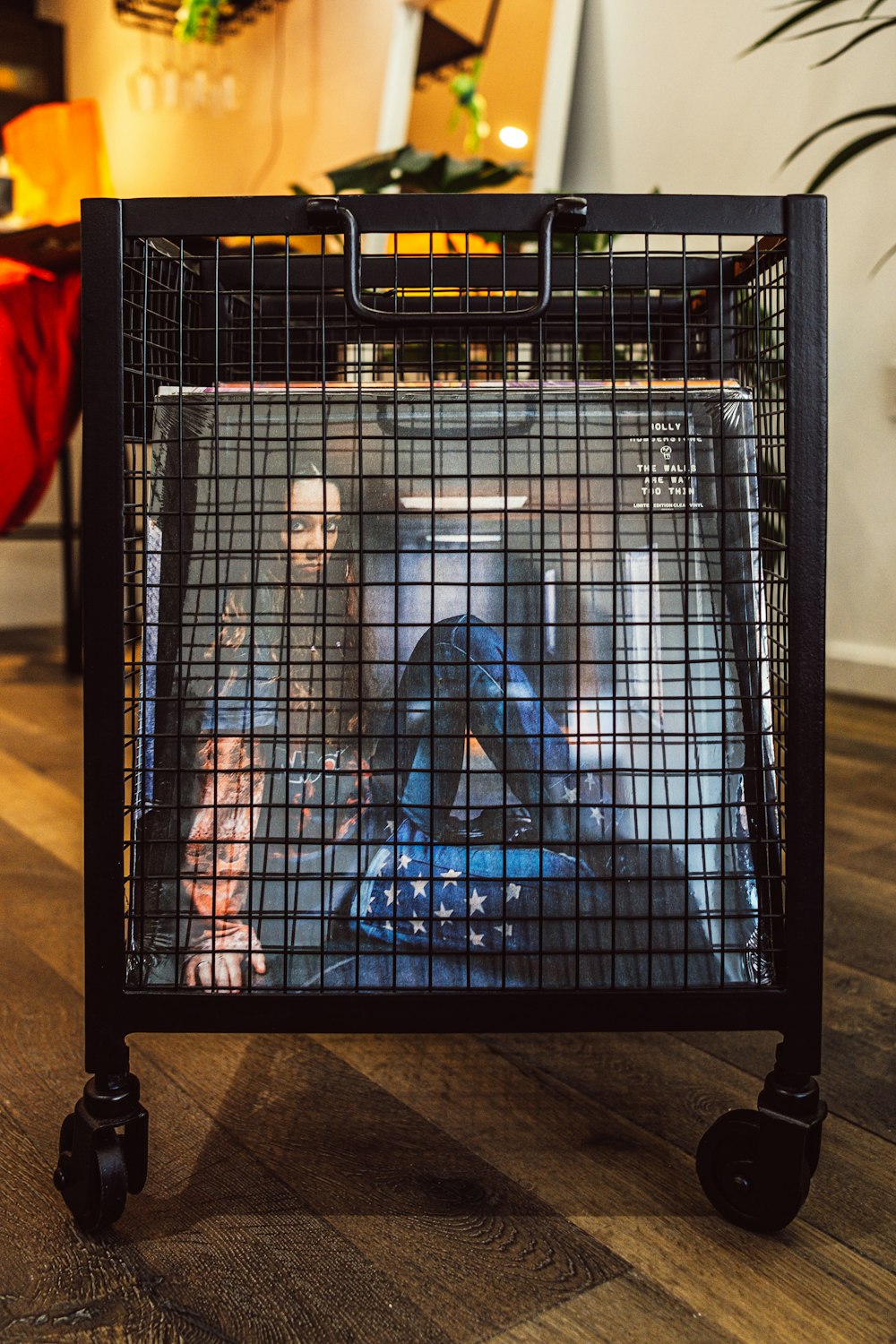 a black cage with a picture of a woman on it