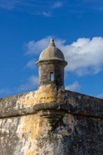 a stone wall with a dome on top of it