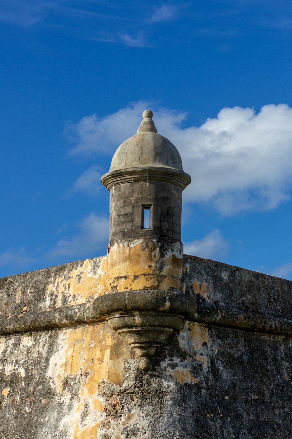 a stone wall with a dome on top of it