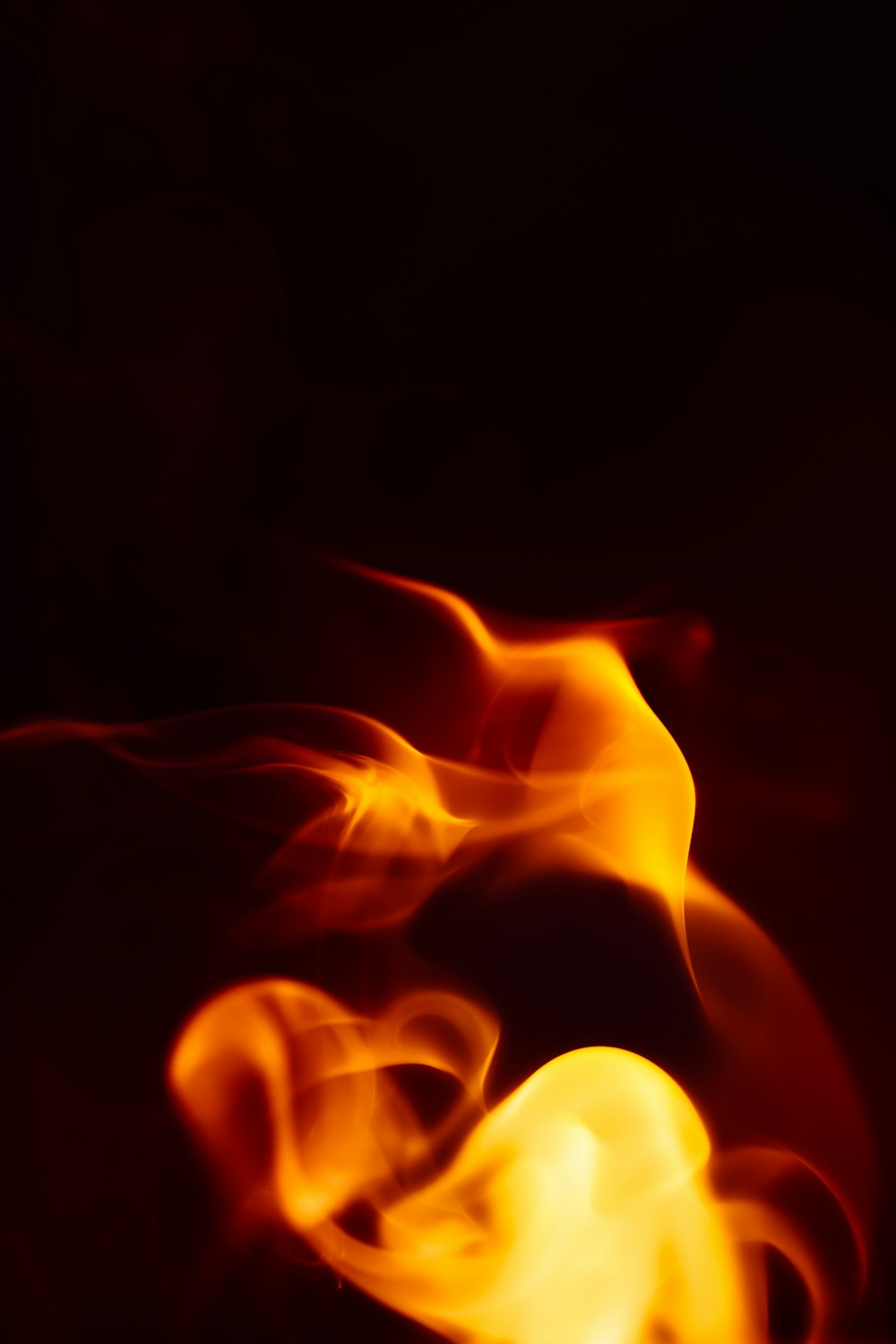 a close up of a fire on a black background