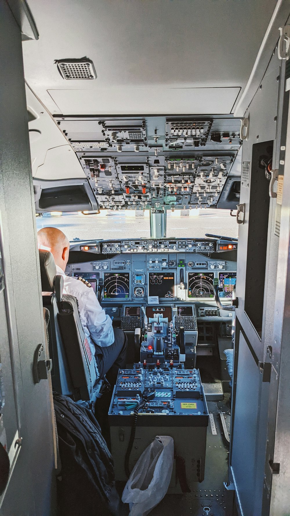 a man sitting in the cockpit of an airplane