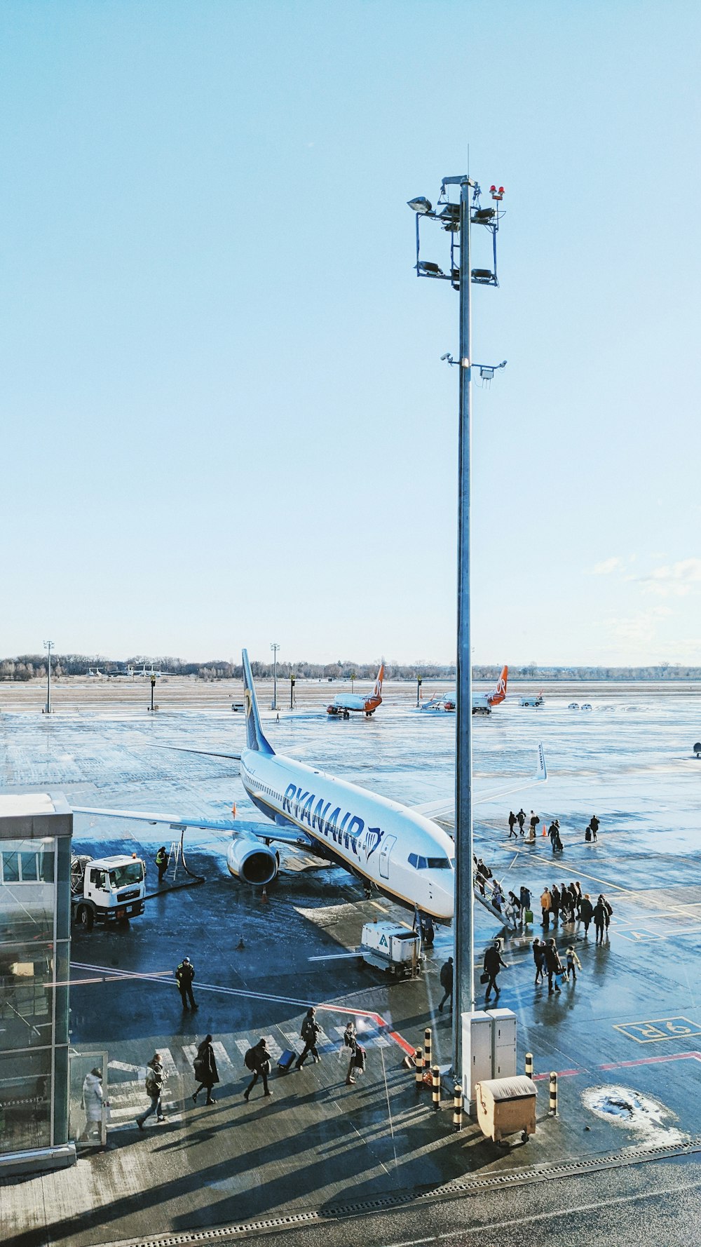 a large jetliner sitting on top of an airport tarmac