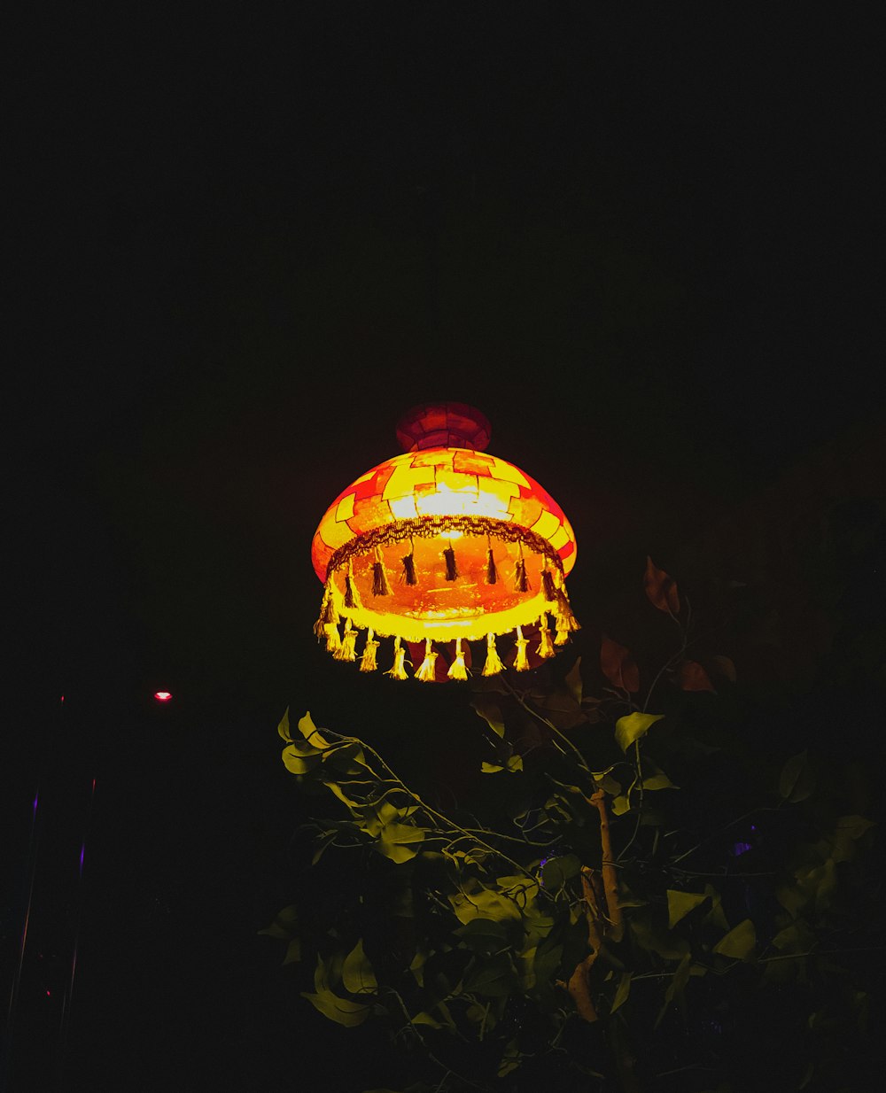 a lamp that is lit up in the dark