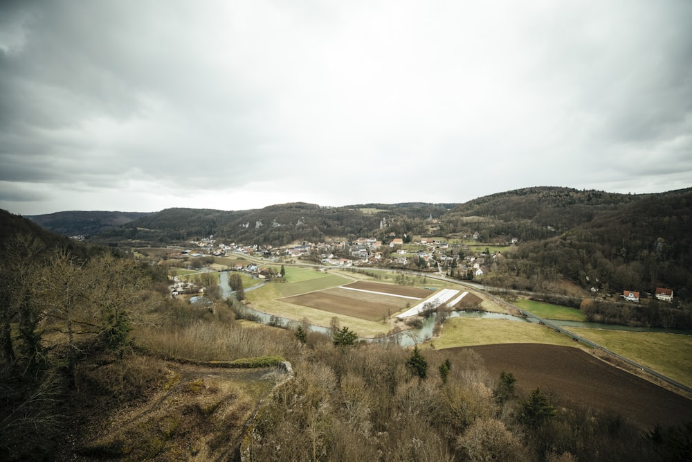 an aerial view of a small town in the mountains