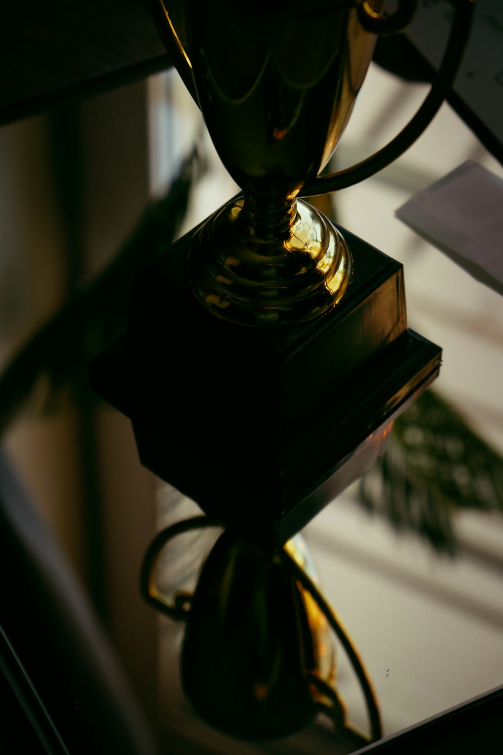 a glass vase sitting on top of a table