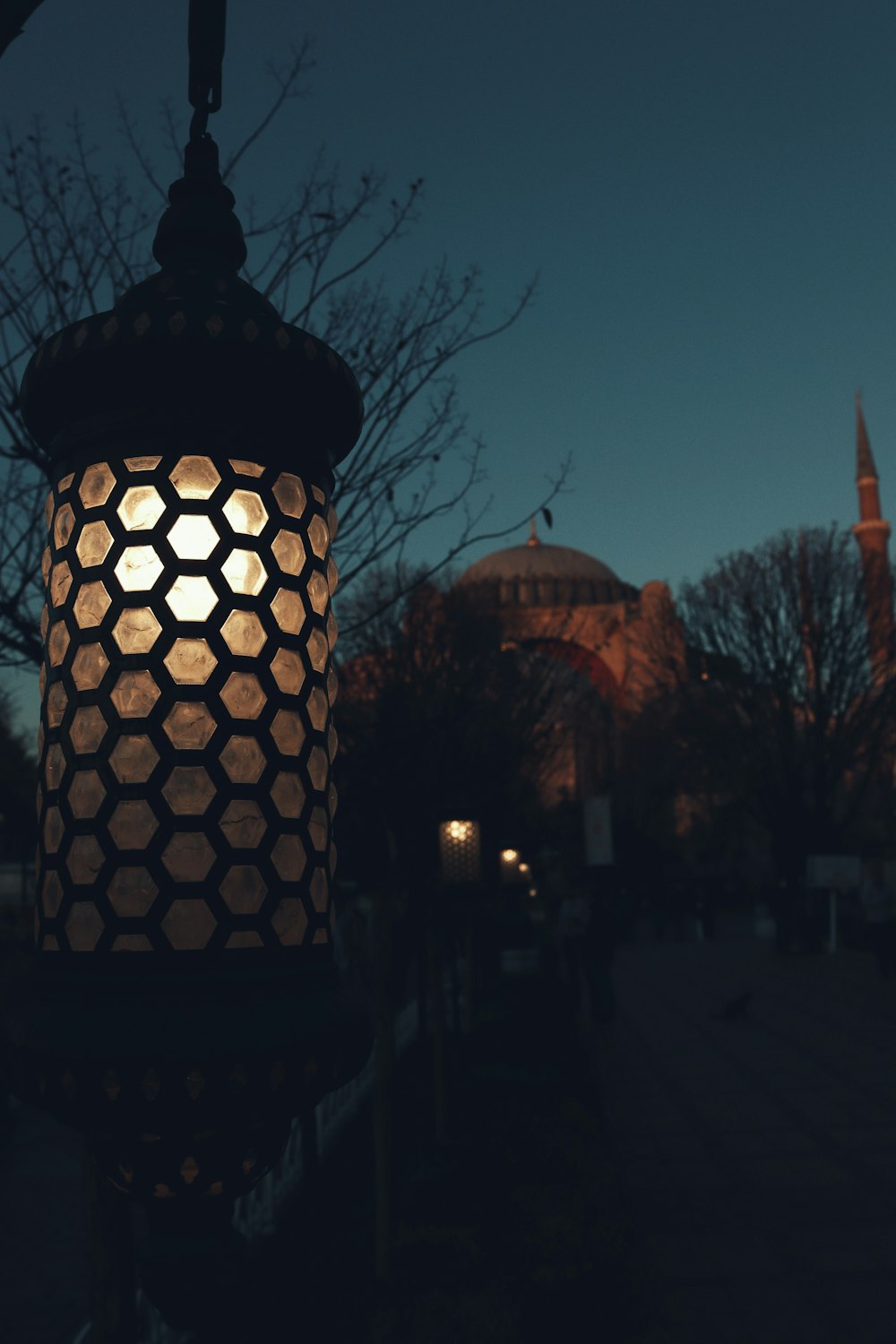 a street light with a building in the background