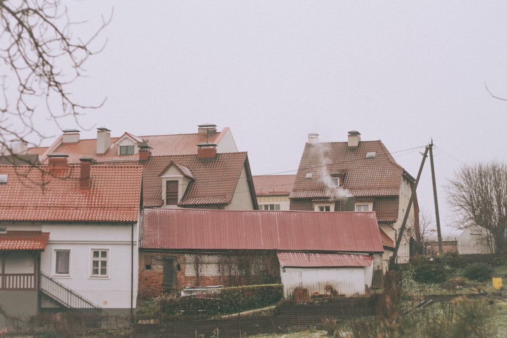 a row of houses with a red roof