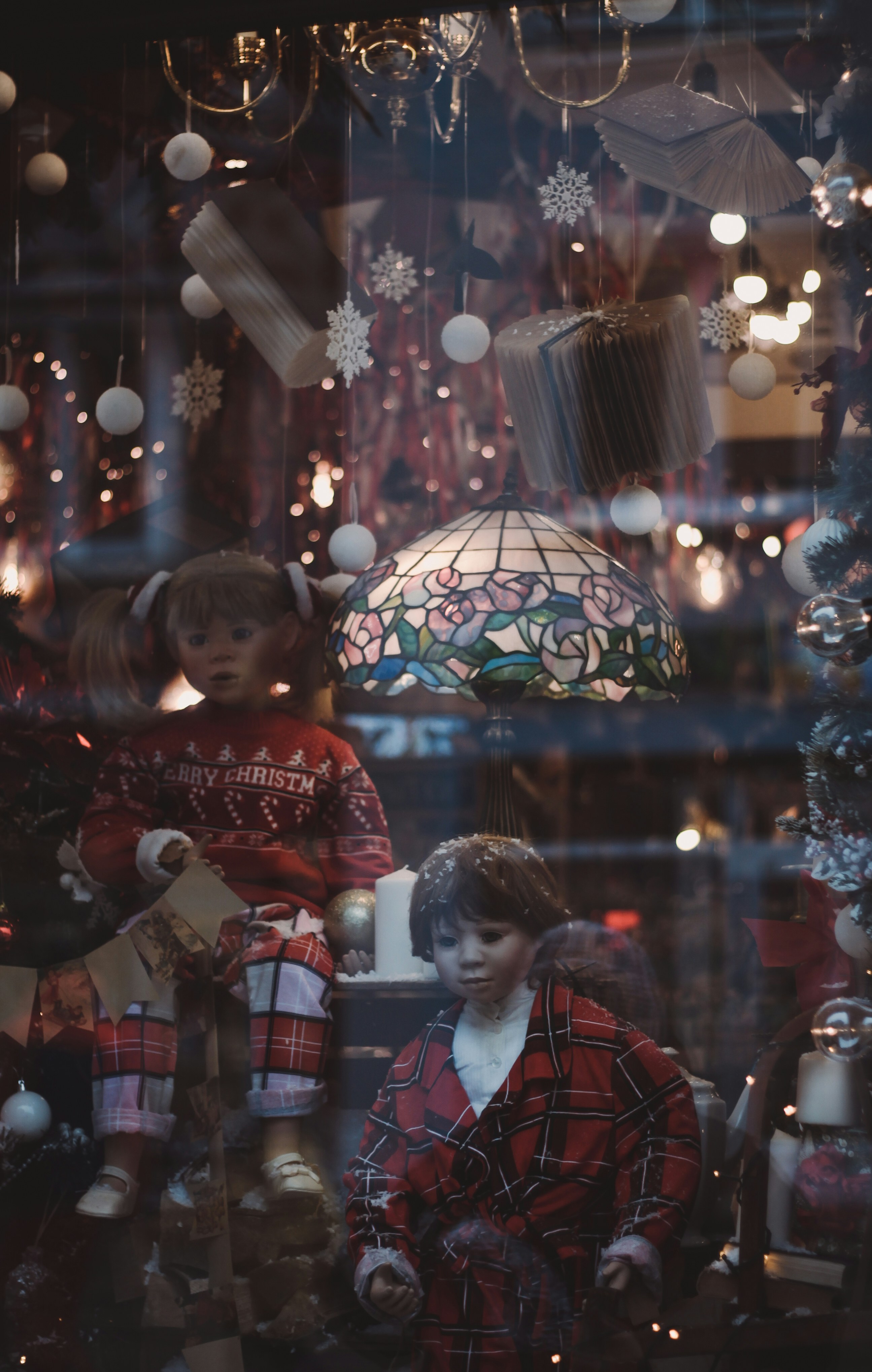a window display with a couple of dolls in it