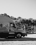 a black and white photo of a truck