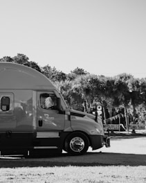 a black and white photo of a truck