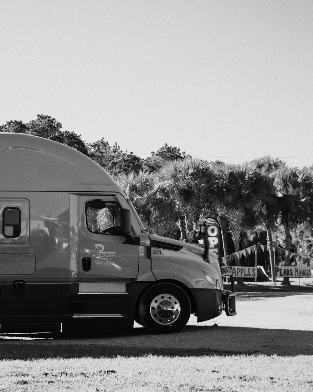 a black and white photo of a truck