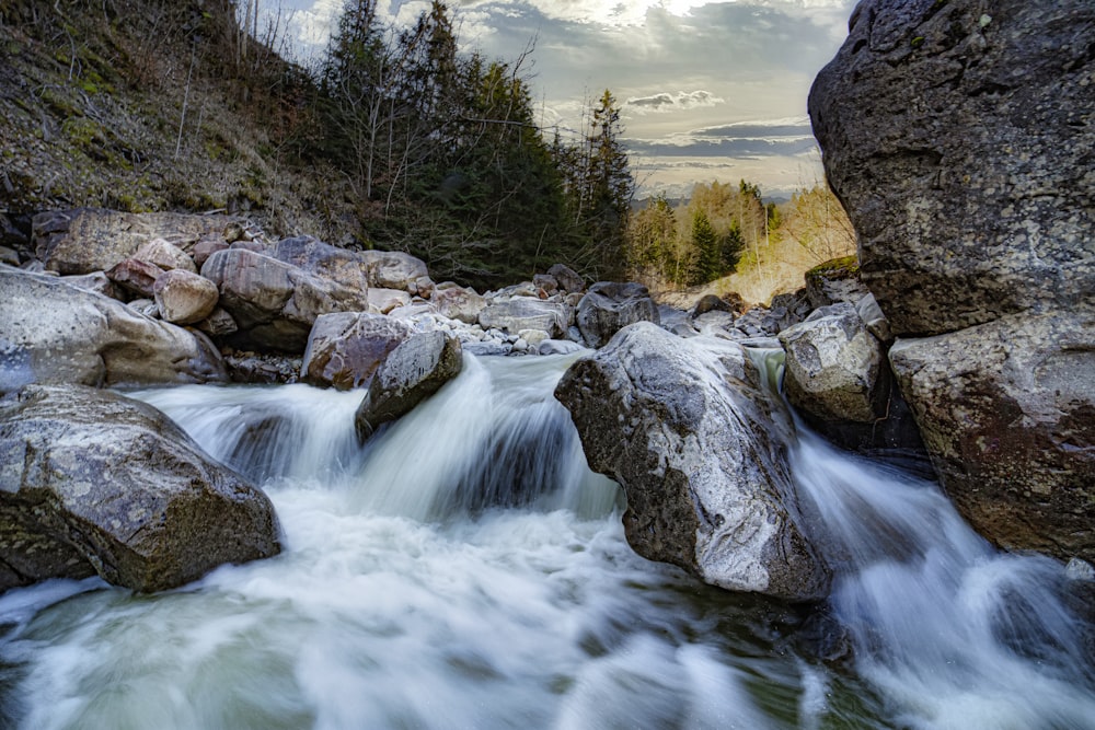 a stream of water running between two large rocks