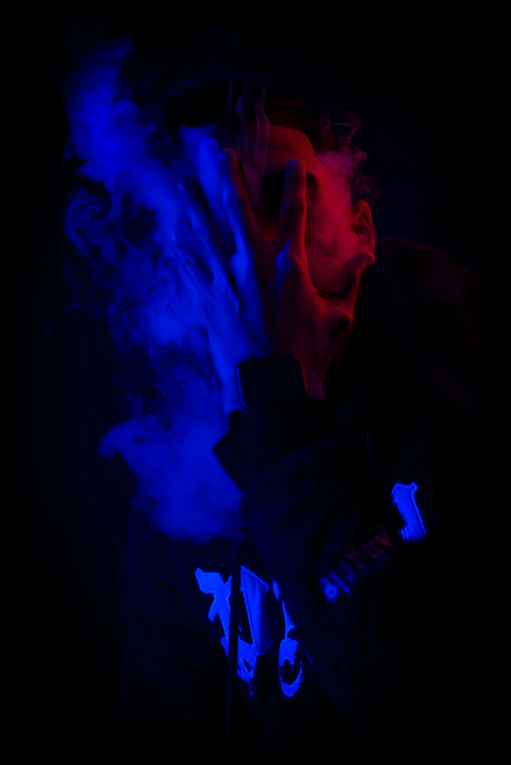 a person with a red and blue light on their face