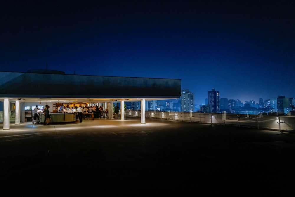 a group of people standing on top of a roof