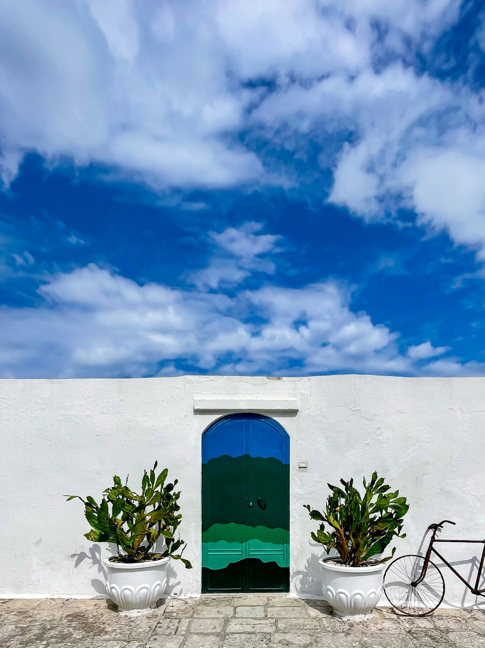 a bike parked in front of a white building