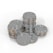 A collection of silver-colored coins stacked in piles, each coin bearing a Bitcoin symbol. The coins are arranged on a white surface, creating a reflective and metallic effect.