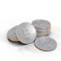 A pile of shiny silver coins decorated with a prominent Bitcoin symbol on the surface. Each coin is meticulously detailed, with engraved text encircling the central logo, indicating a digital currency motif.