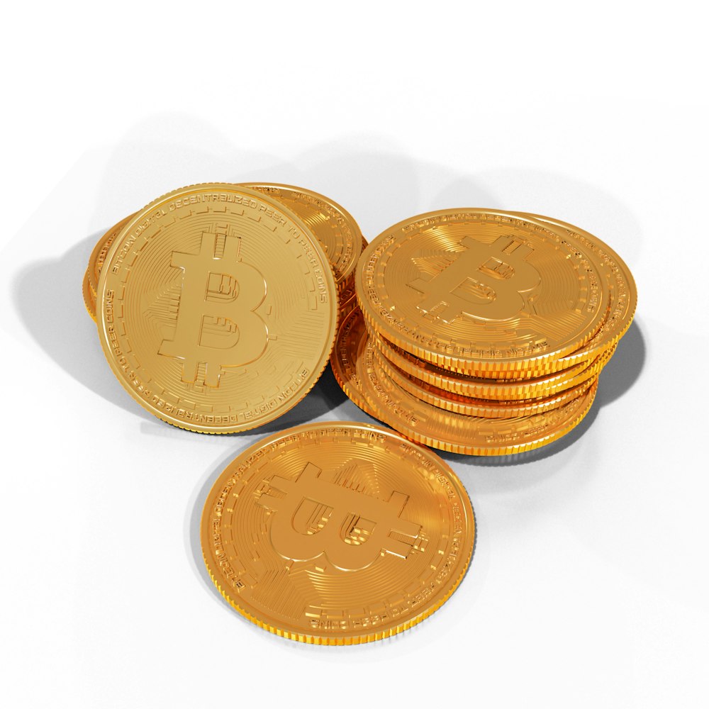 a pile of gold bitcoins sitting on top of each other