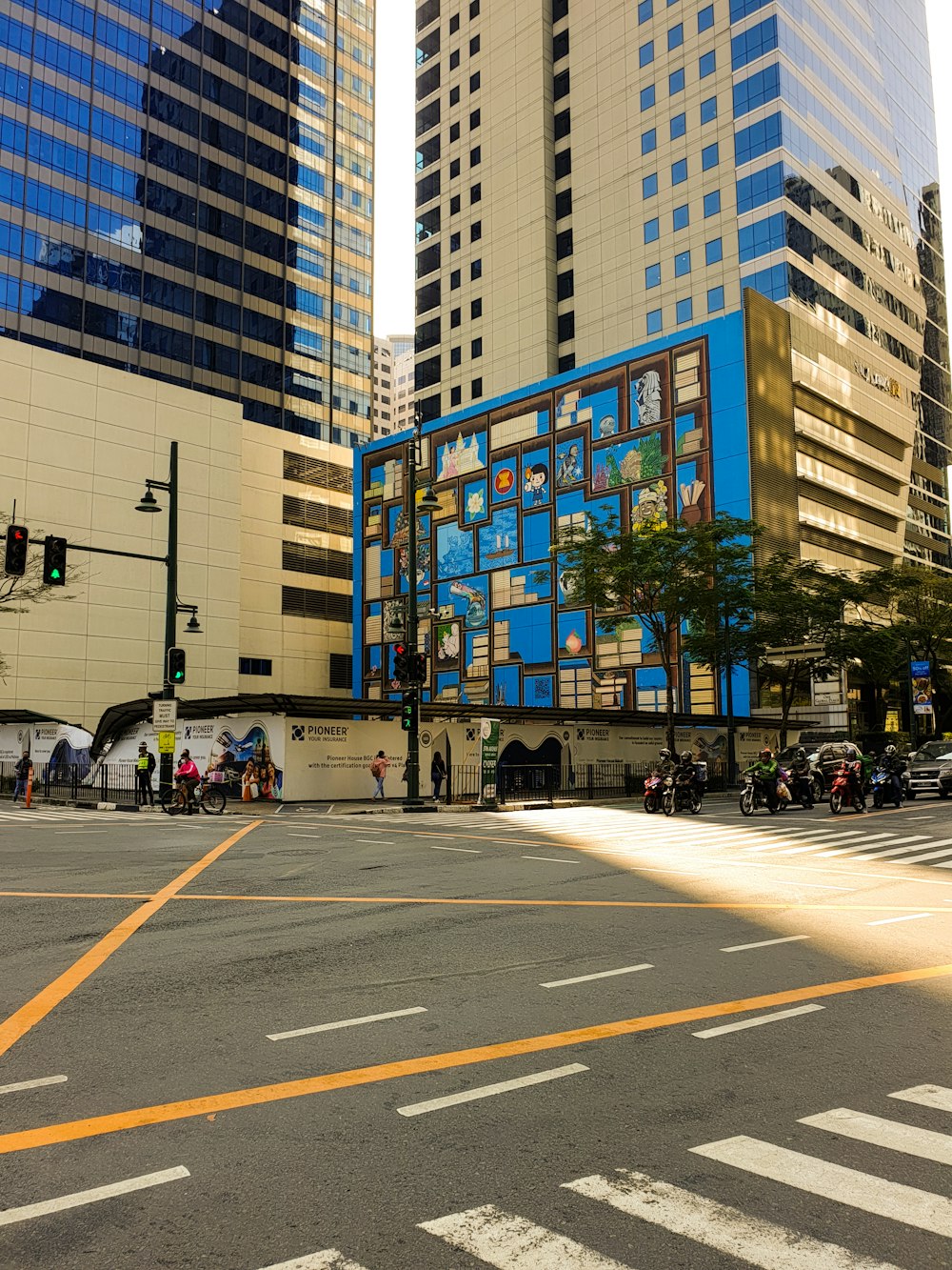 a city street with tall buildings and a traffic light