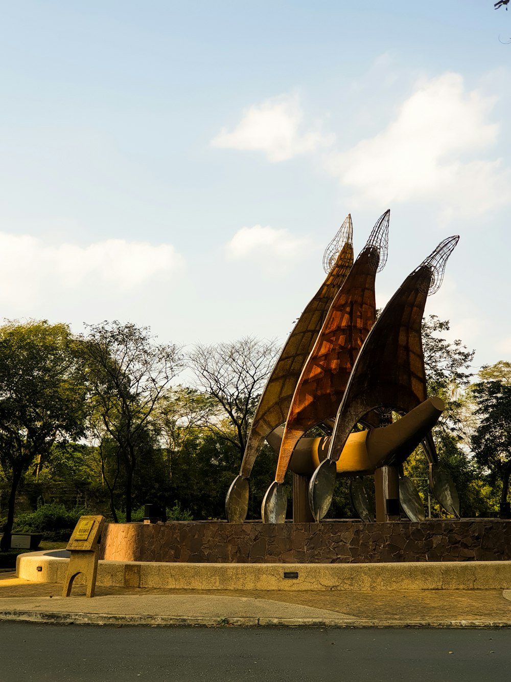 a couple of large metal sculptures sitting next to each other