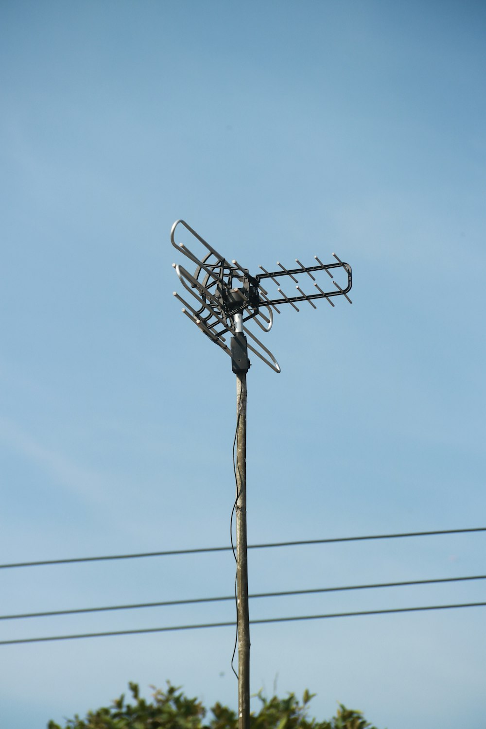 a television antenna on top of a pole