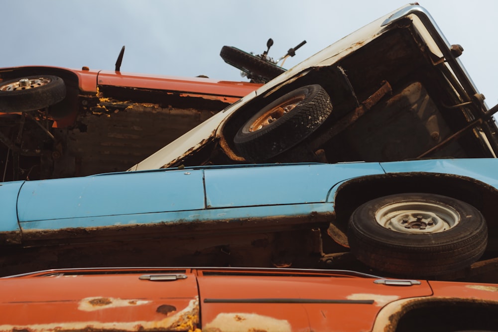 a blue and orange truck sitting next to each other