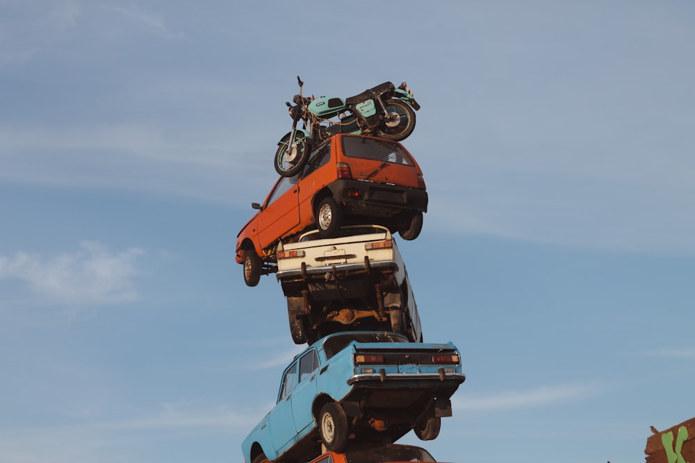 a motorcycle on top of a car in the air