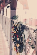 Brightly colored Christmas garlands made from sustainable materials draped over a mantel.