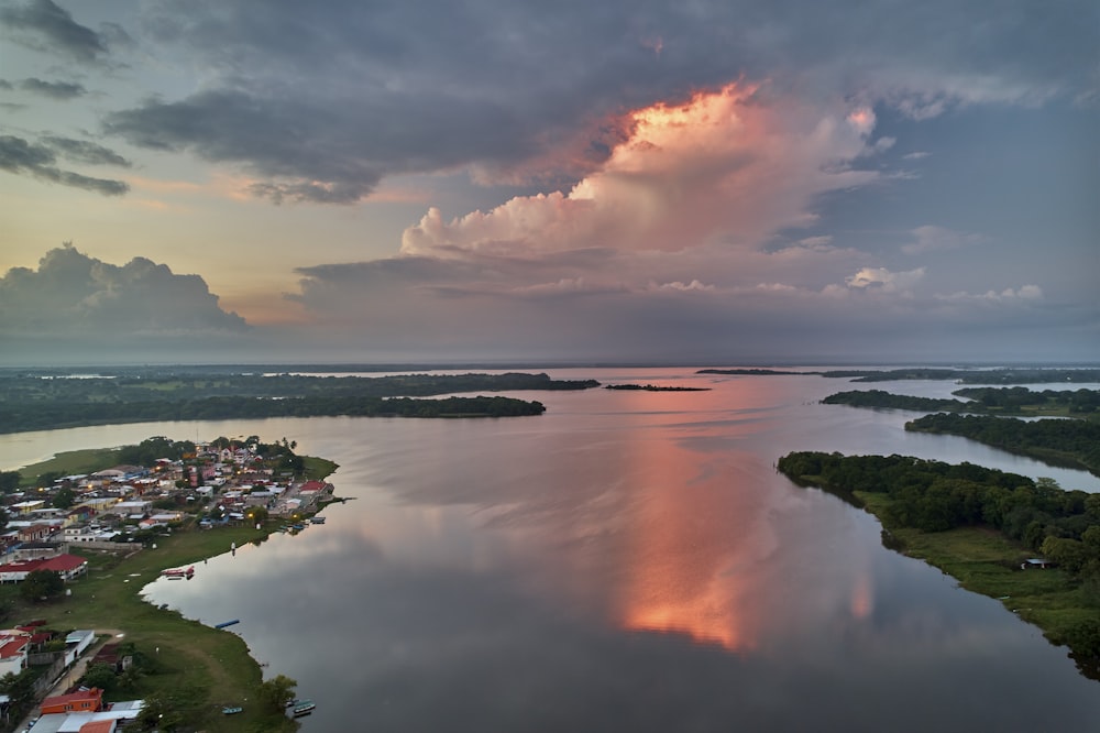 a large body of water under a cloudy sky