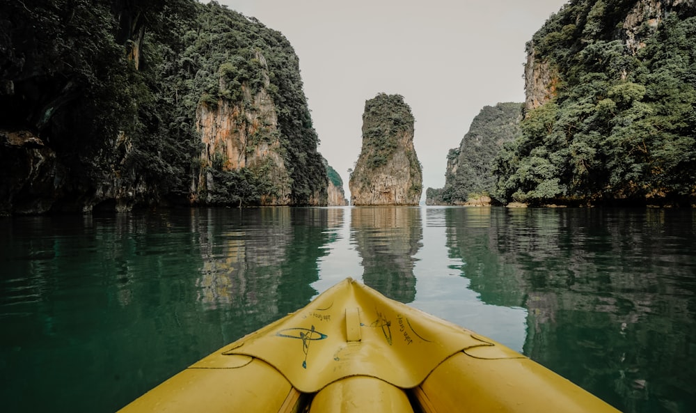 a yellow kayak in the middle of a body of water