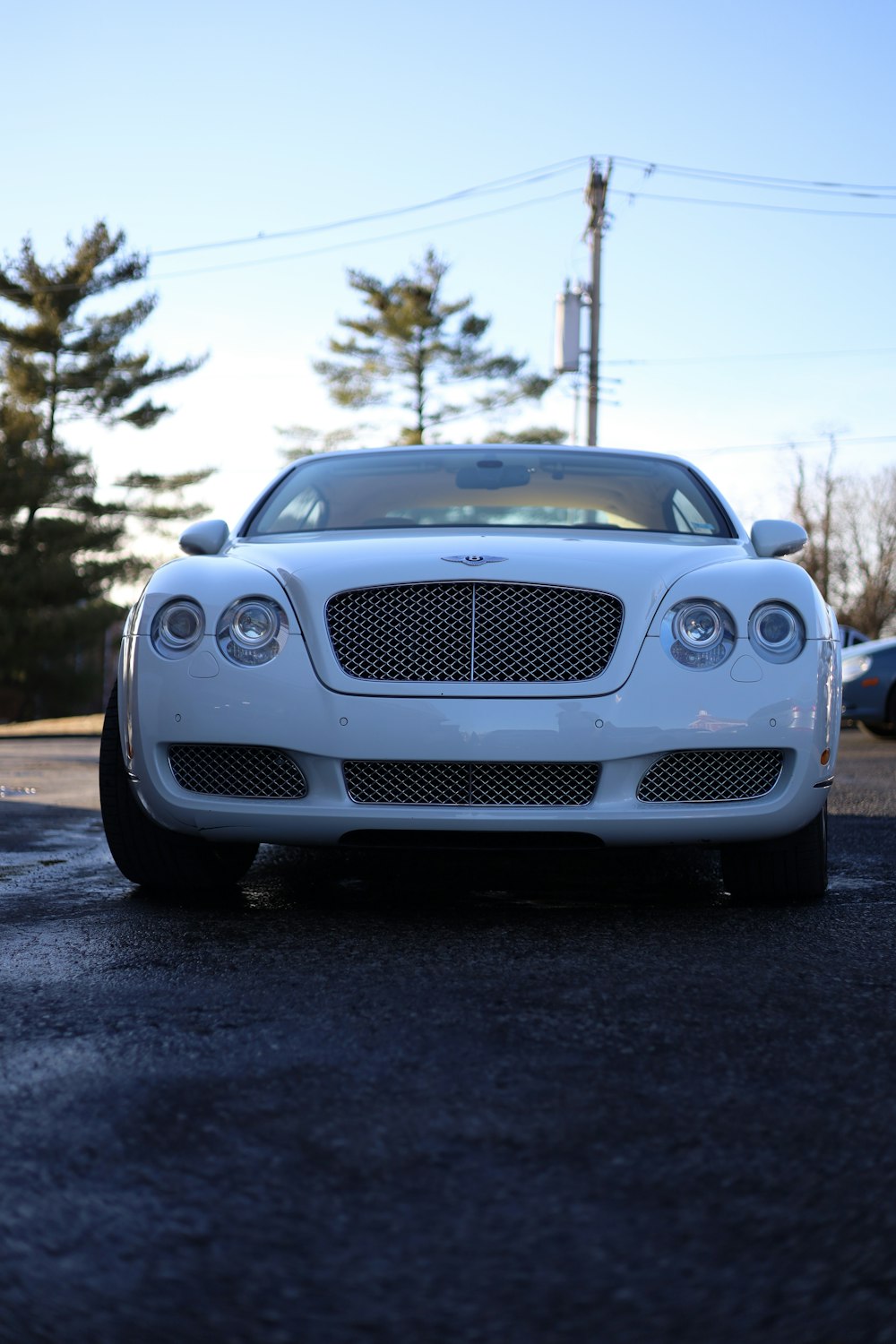 a white car parked on the side of the road