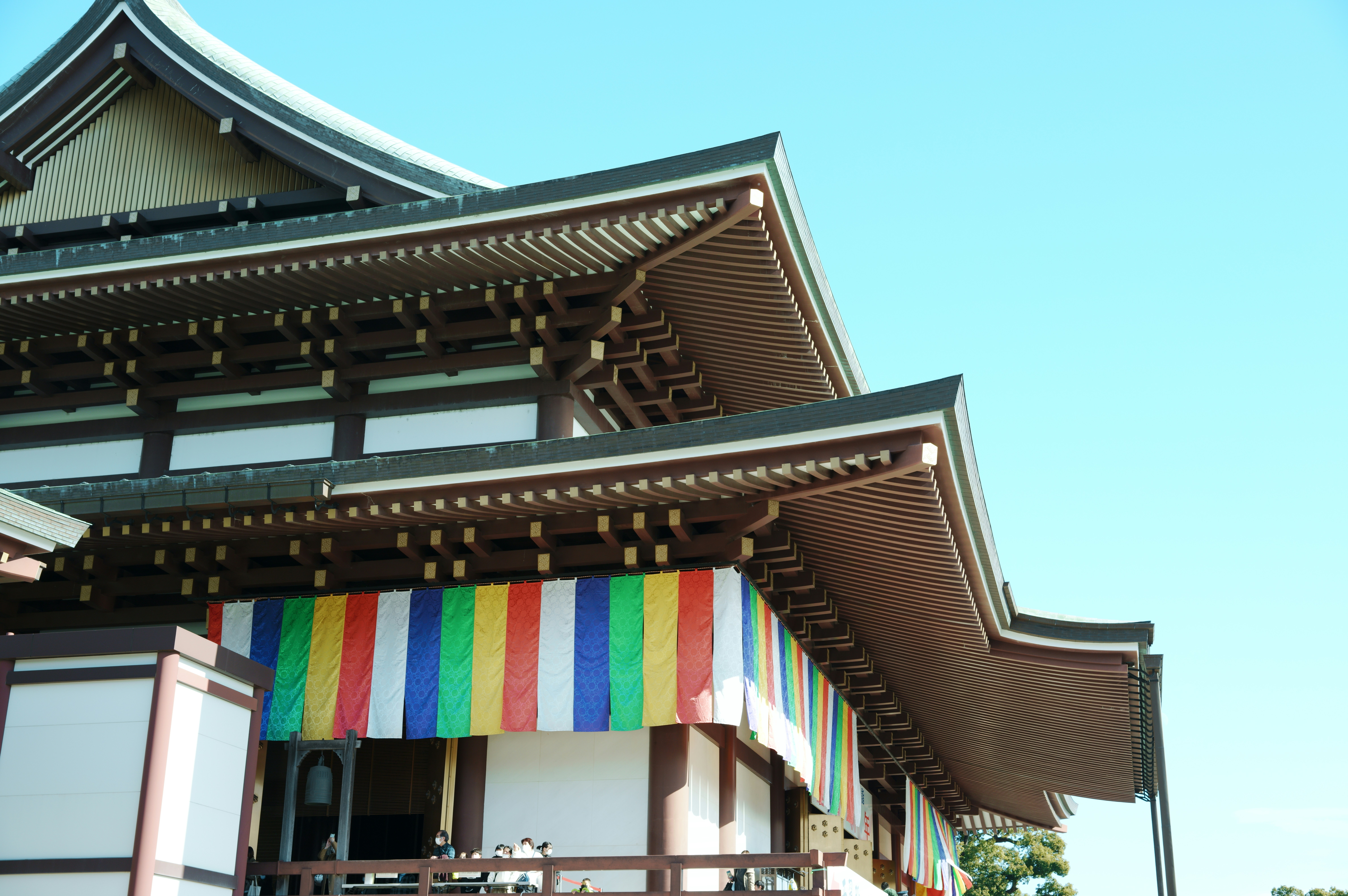 a tall building with a multicolored awning