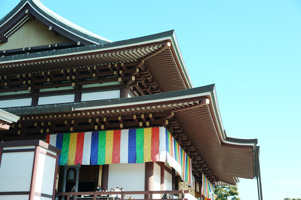 a tall building with a multicolored awning