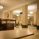 An elegant auction house interior with bright lighting.