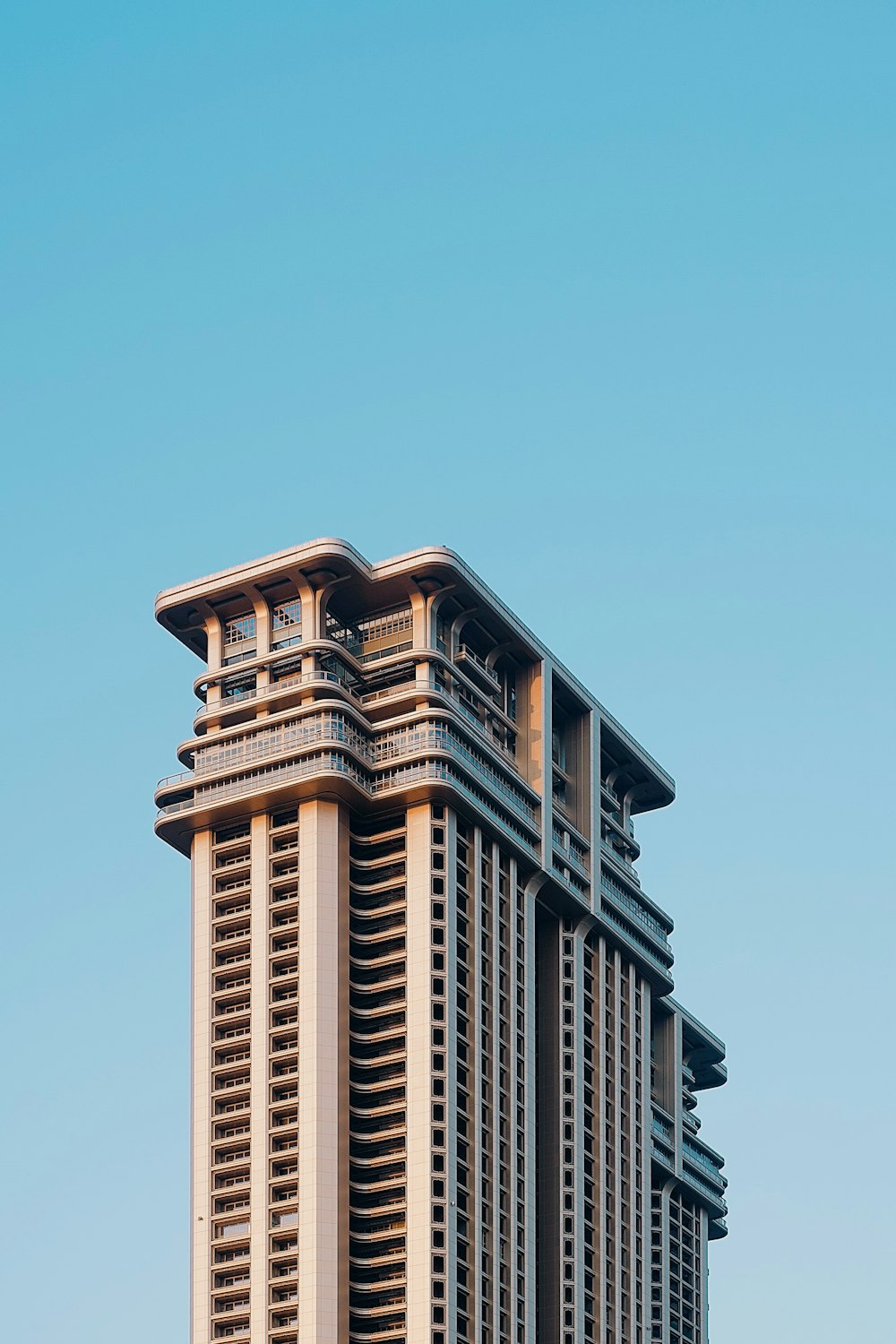 a tall building with a clock on the top of it