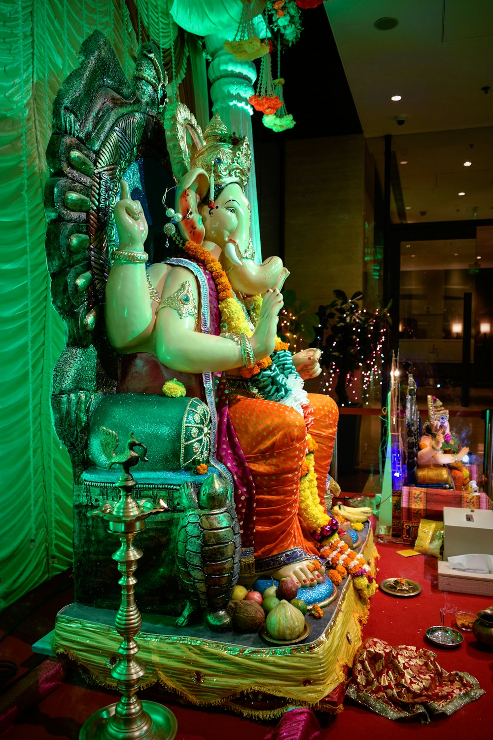 a statue of a hindu god in a room