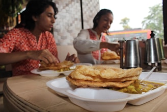 A satisfied customer enjoying a tiffin meal.