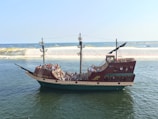a large boat filled with people on a body of water