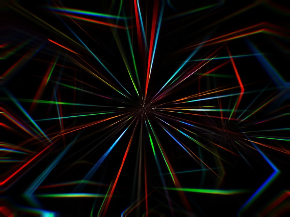an abstract image of colorful lines in the dark