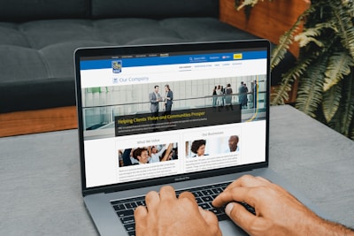 a man using a laptop computer on a table
